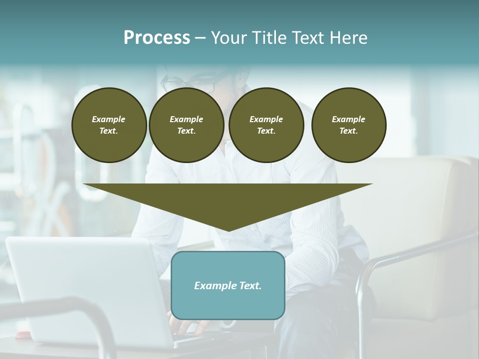 A Man Sitting At A Table Using A Laptop Computer PowerPoint Template