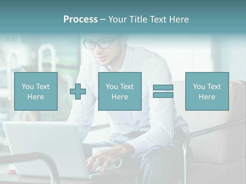 A Man Sitting At A Table Using A Laptop Computer PowerPoint Template