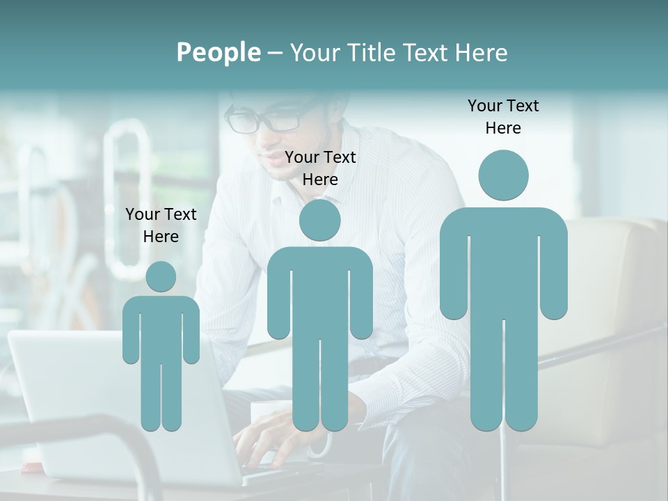 A Man Sitting At A Table Using A Laptop Computer PowerPoint Template