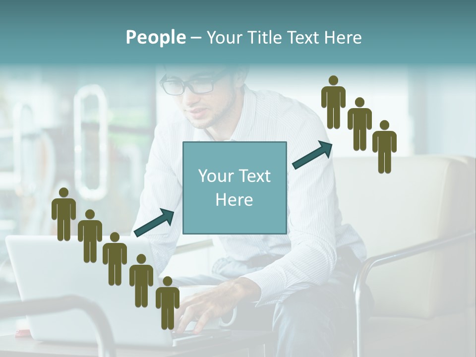 A Man Sitting At A Table Using A Laptop Computer PowerPoint Template