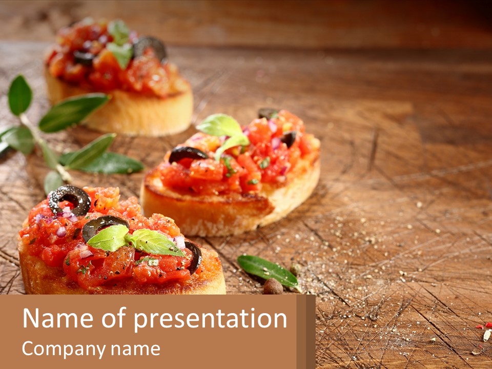 A Wooden Table Topped With Mini Pizzas Covered In Toppings PowerPoint Template