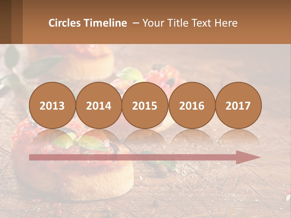 A Wooden Table Topped With Mini Pizzas Covered In Toppings PowerPoint Template