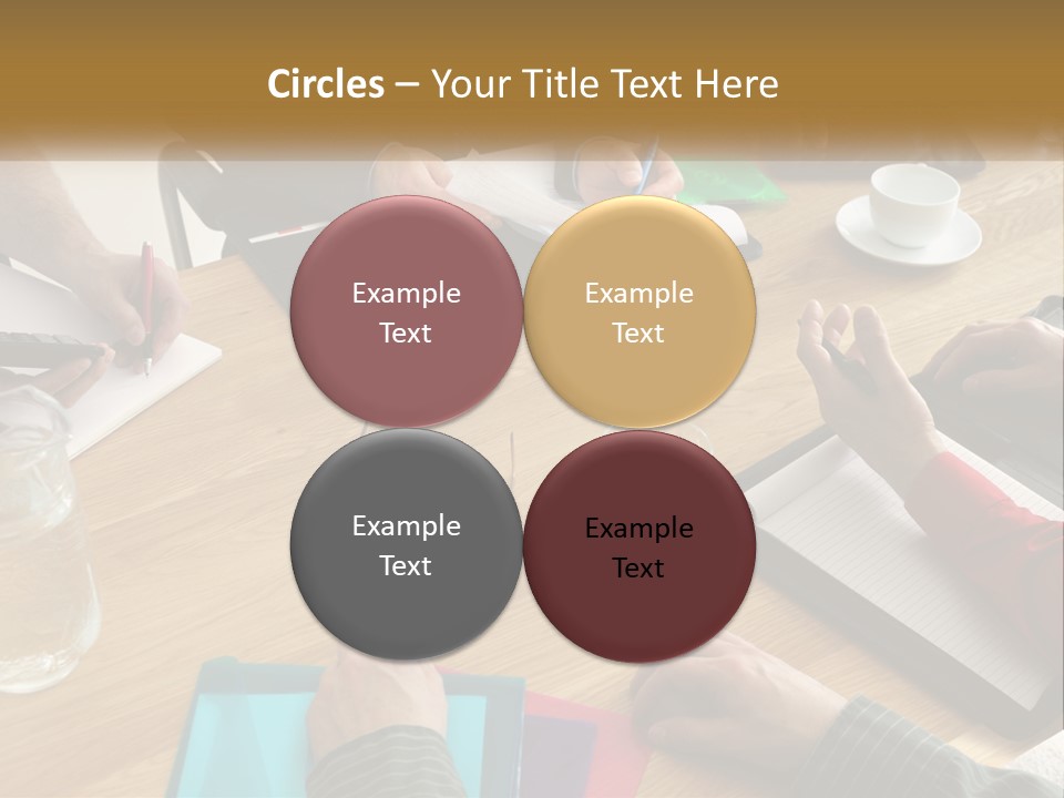 A Group Of People Sitting Around A Wooden Table PowerPoint Template