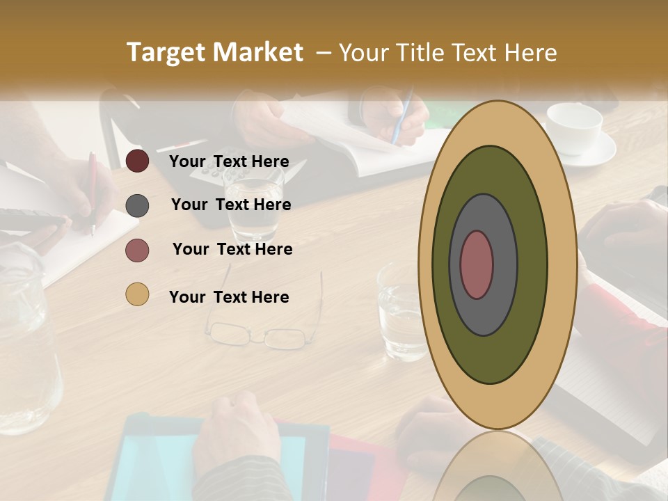 A Group Of People Sitting Around A Wooden Table PowerPoint Template