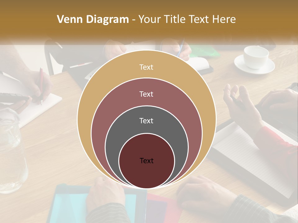 A Group Of People Sitting Around A Wooden Table PowerPoint Template