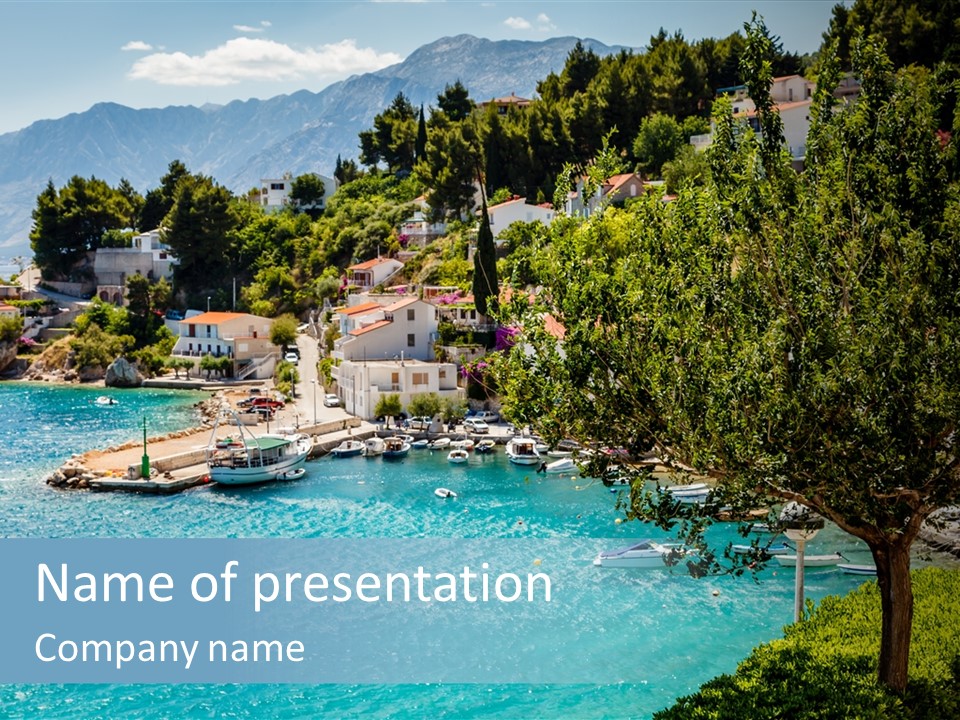 A Lake With Boats In It And A Mountain In The Background PowerPoint Template