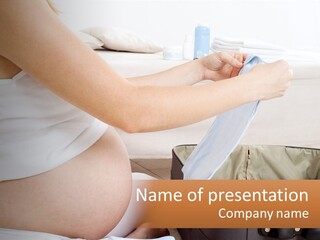 A Pregnant Woman In A White Dress Is Holding A Blue Piece Of Cloth PowerPoint Template