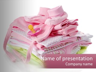A Pile Of Baby Clothes With A Pacifier On Top Of It PowerPoint Template