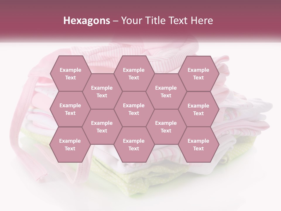 A Pile Of Baby Clothes With A Pacifier On Top Of It PowerPoint Template