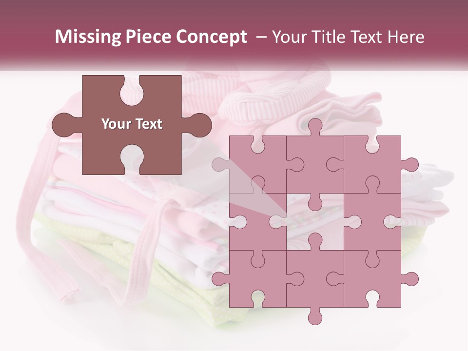A Pile Of Baby Clothes With A Pacifier On Top Of It PowerPoint Template