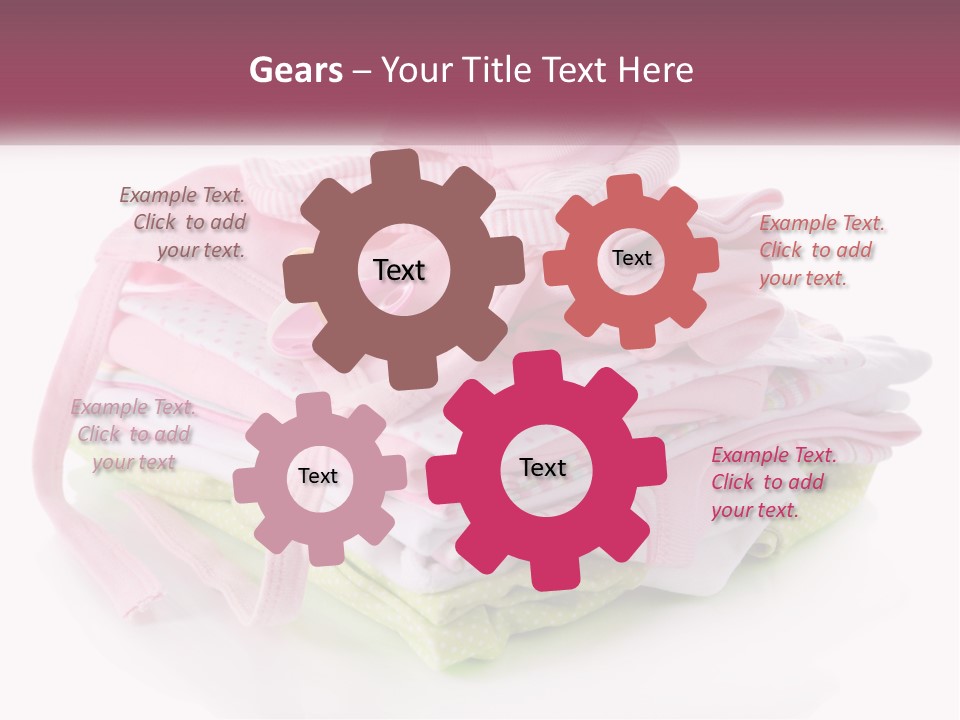 A Pile Of Baby Clothes With A Pacifier On Top Of It PowerPoint Template