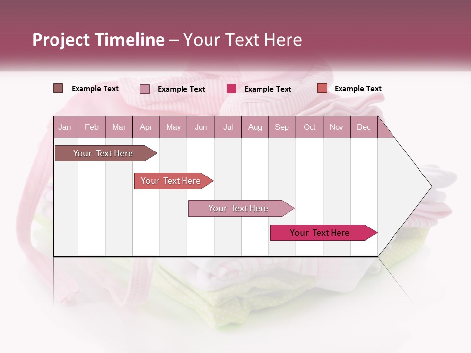 A Pile Of Baby Clothes With A Pacifier On Top Of It PowerPoint Template