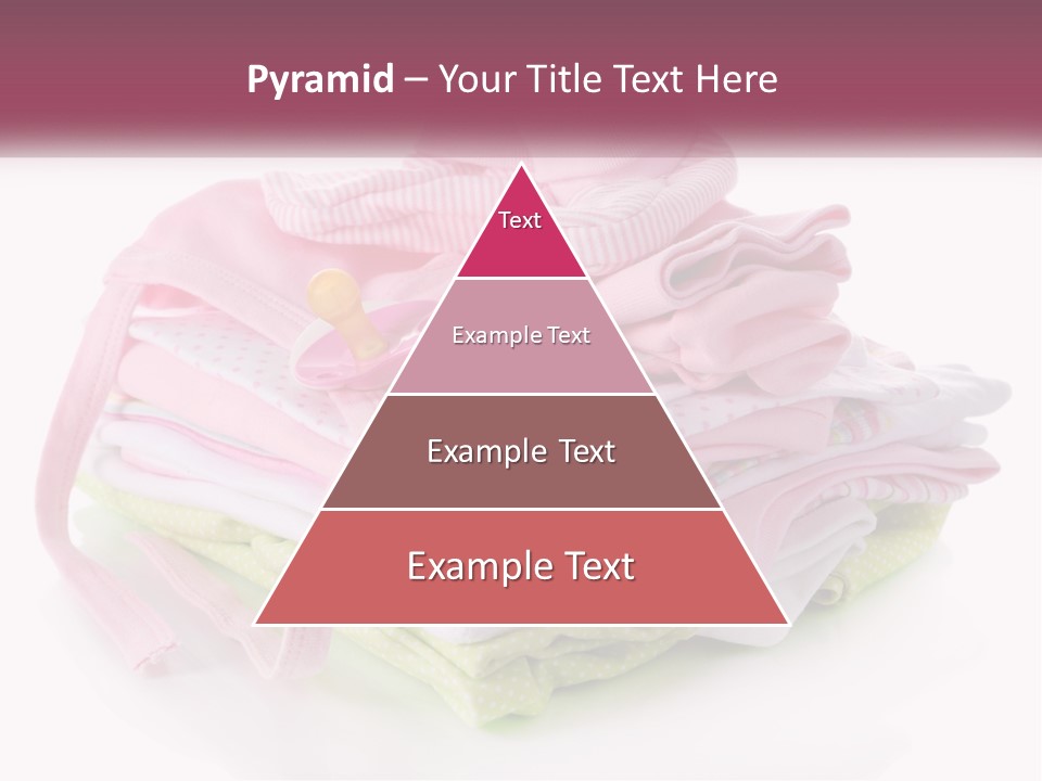 A Pile Of Baby Clothes With A Pacifier On Top Of It PowerPoint Template