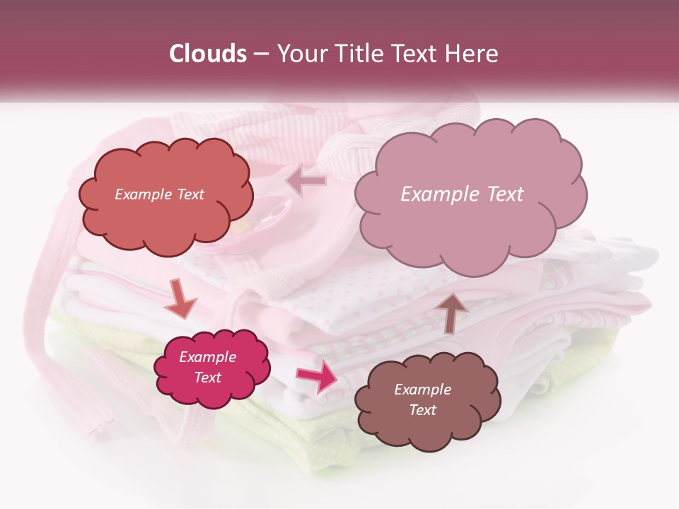 A Pile Of Baby Clothes With A Pacifier On Top Of It PowerPoint Template