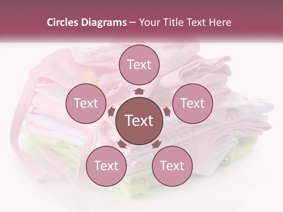 A Pile Of Baby Clothes With A Pacifier On Top Of It PowerPoint Template