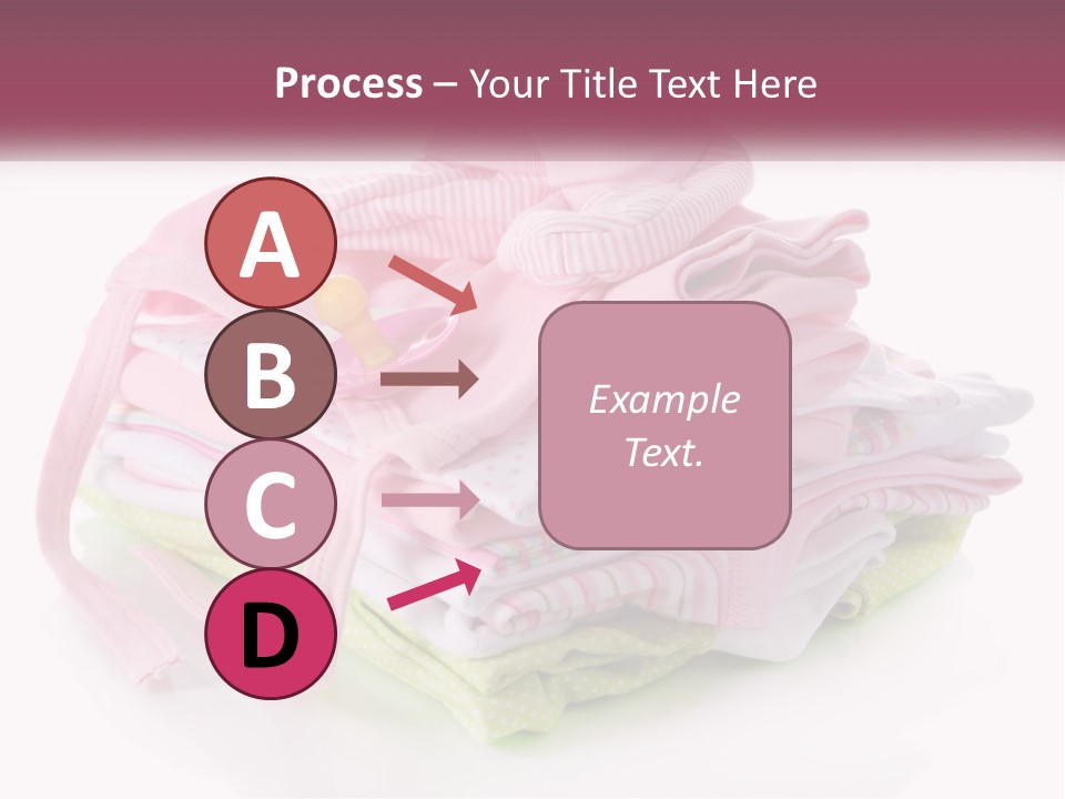 A Pile Of Baby Clothes With A Pacifier On Top Of It PowerPoint Template