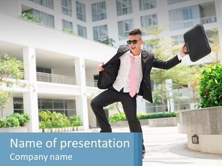 A Man In A Suit And Tie Holding A Briefcase PowerPoint Template