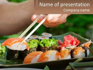 A Person Holding Chopsticks Over A Plate Of Sushi PowerPoint Template