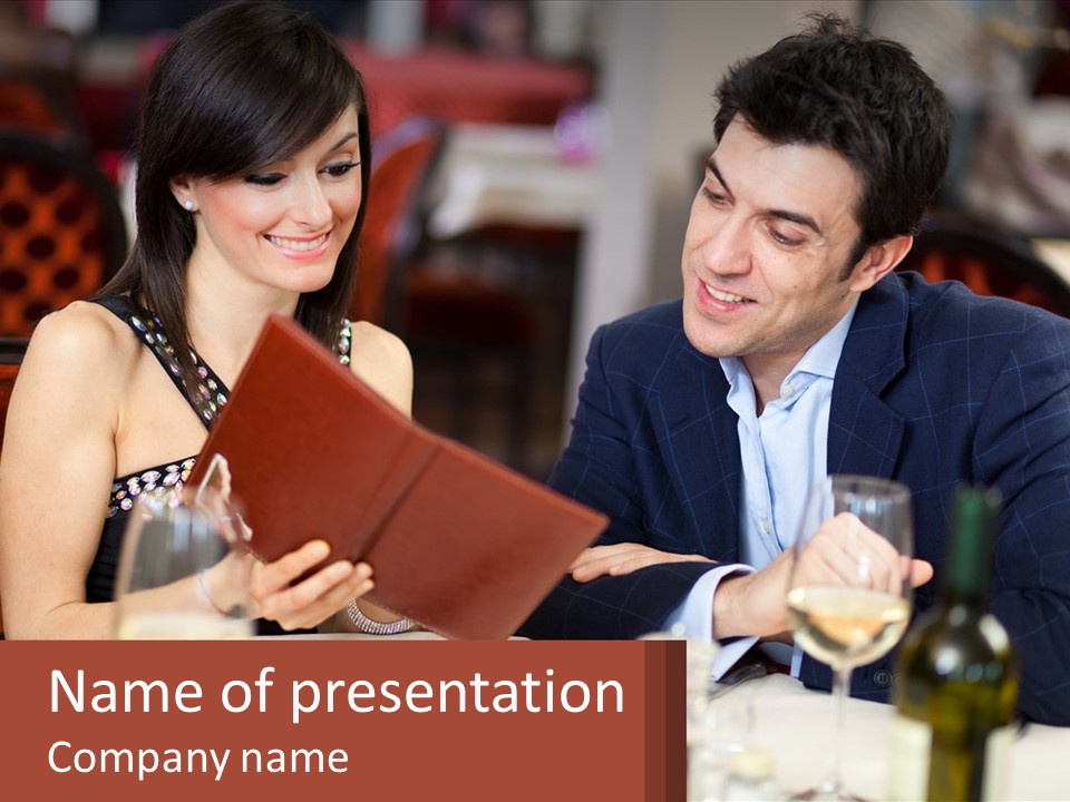 A Man And Woman Sitting At A Table With A Menu PowerPoint Template
