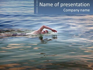A Person Swimming In A Body Of Water PowerPoint Template