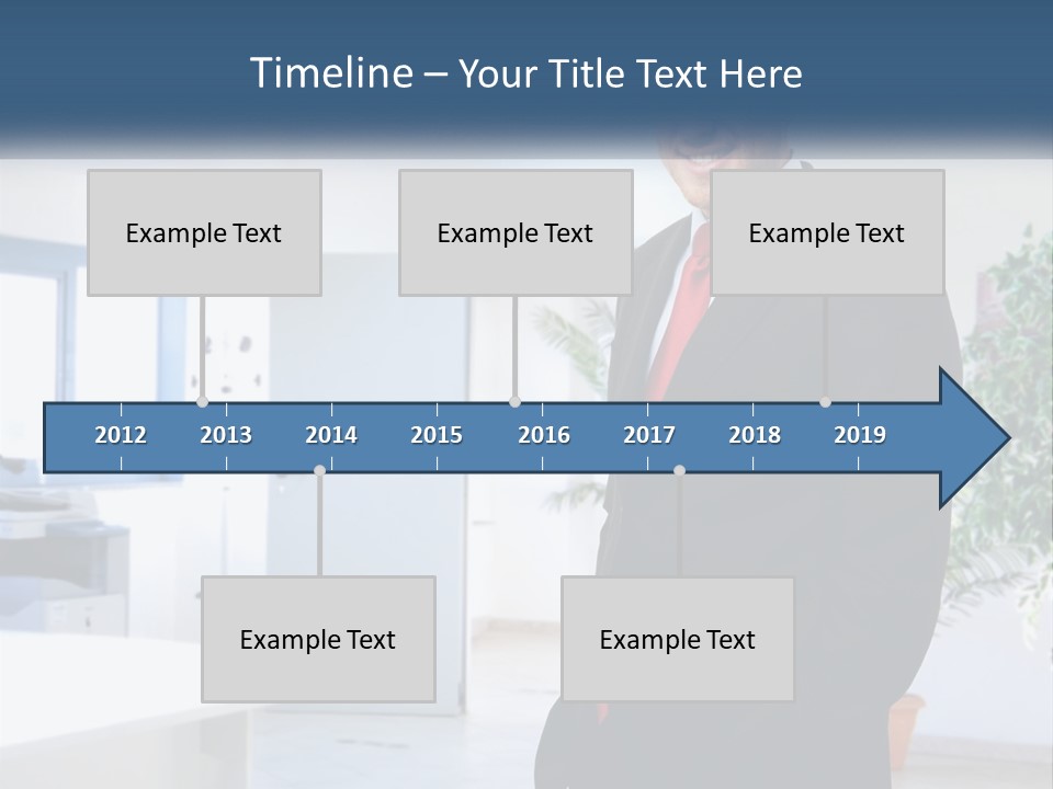 A Man In A Suit Standing In A Room PowerPoint Template