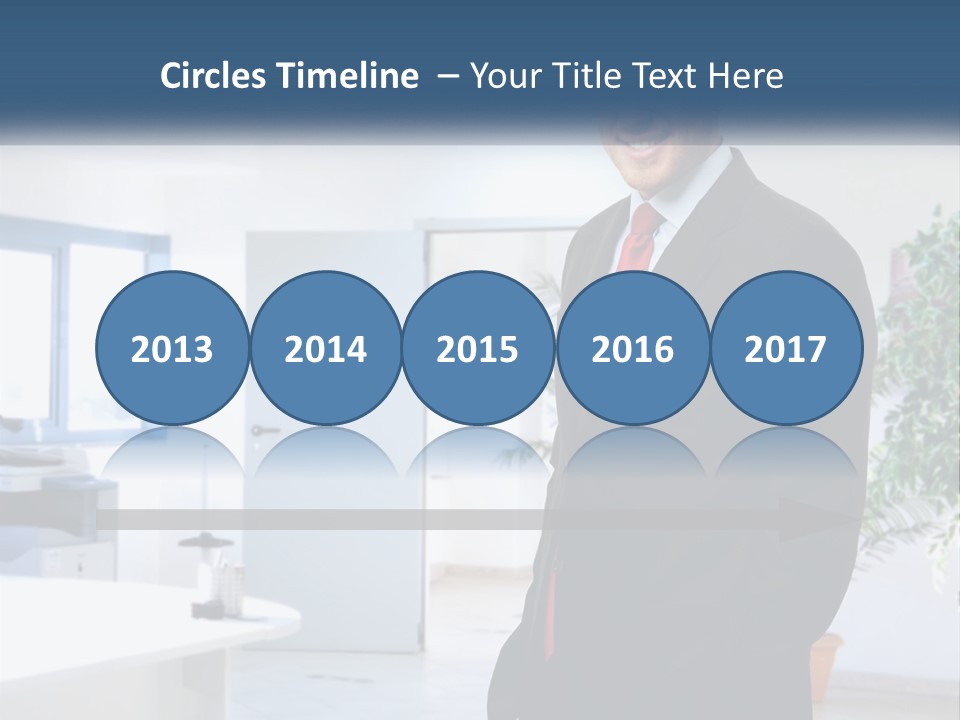 A Man In A Suit Standing In A Room PowerPoint Template