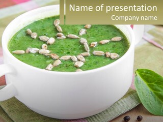 A White Bowl Filled With A Green Soup PowerPoint Template
