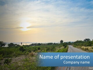 A Road In The Middle Of A Field With A Sky Background PowerPoint Template
