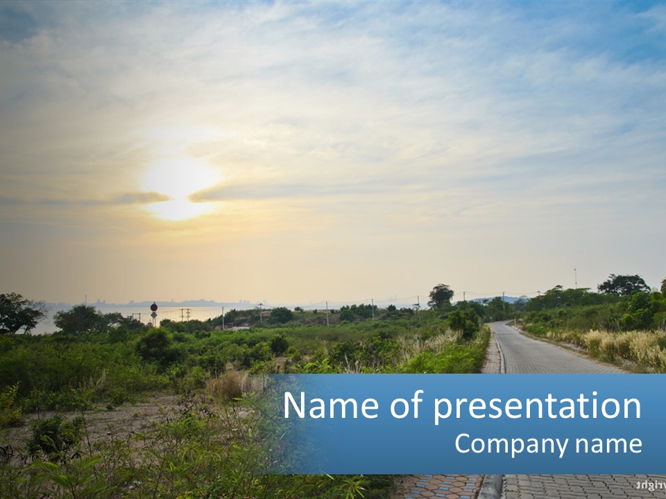 A Road In The Middle Of A Field With A Sky Background PowerPoint Template