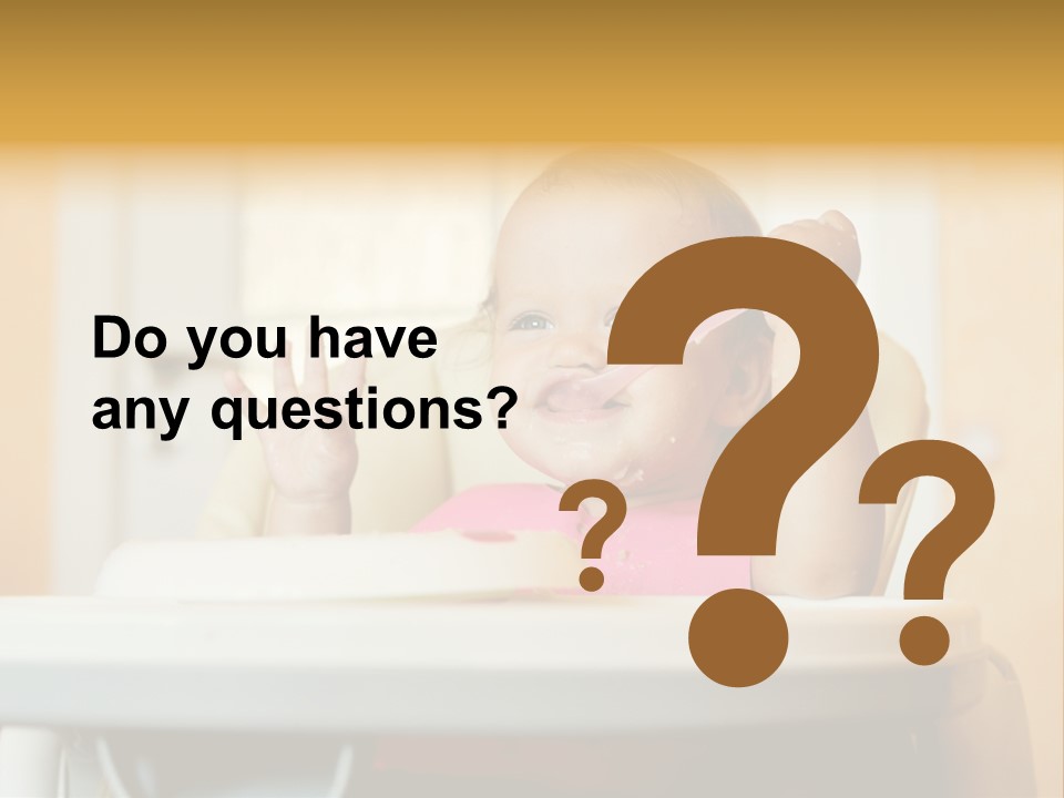 A Baby Sitting In A High Chair With A Spoon In It's Mouth PowerPoint Template