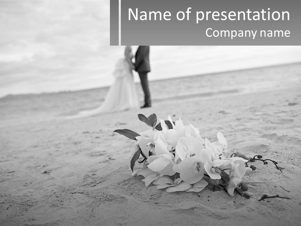 A Couple Standing On A Beach Next To A Bouquet Of Flowers PowerPoint Template