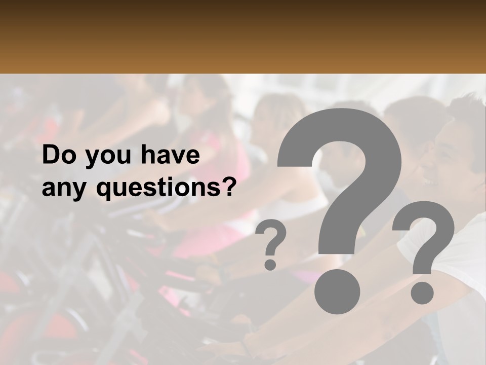 A Group Of People Riding Stationary Bikes In A Gym PowerPoint Template