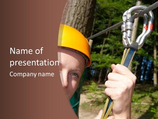 A Man Holding A Rope With A Helmet On His Head PowerPoint Template