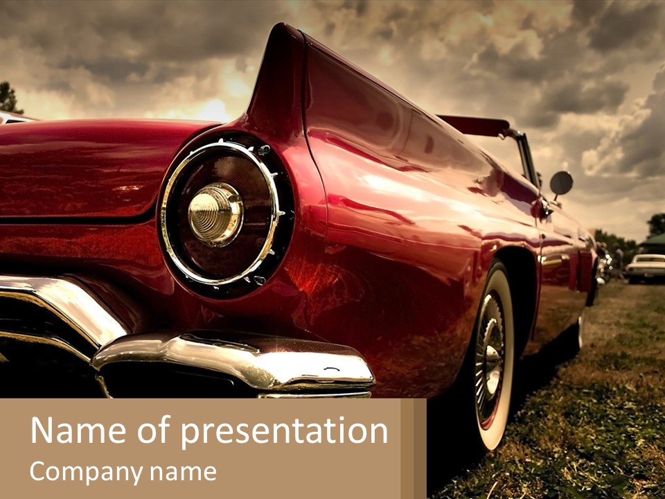 A Red Car Is Parked On The Grass PowerPoint Template