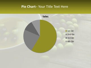 A Bowl Of Olives And Bread On A Table PowerPoint Template