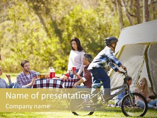 A Group Of People Sitting Around A Tent PowerPoint Template