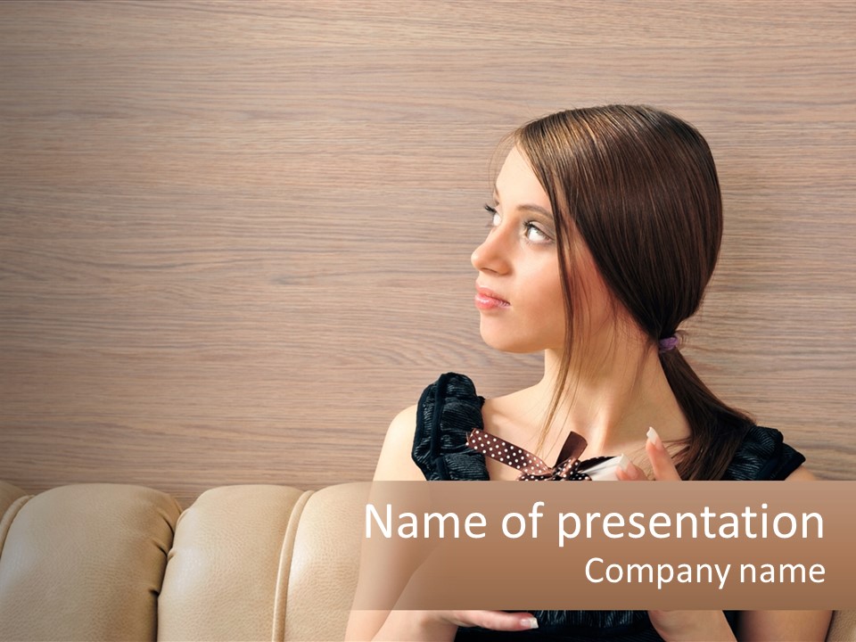A Woman Sitting On A Couch With Her Hand On Her Chest PowerPoint Template