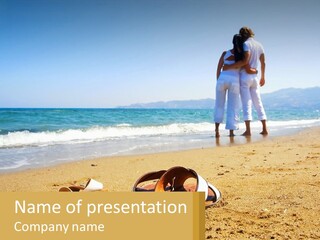 A Couple Of People Standing On Top Of A Sandy Beach PowerPoint Template