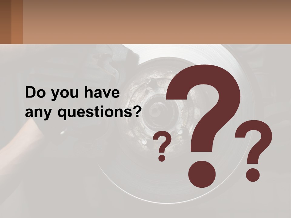 A Man Is Changing A Brake On A Car PowerPoint Template