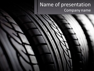 A Row Of Tires With A Black Background PowerPoint Template