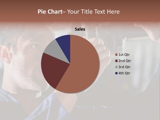 A Man Working On A Car In A Garage PowerPoint Template