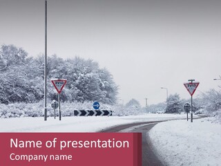 A Snowy Road With Traffic Signs On It PowerPoint Template