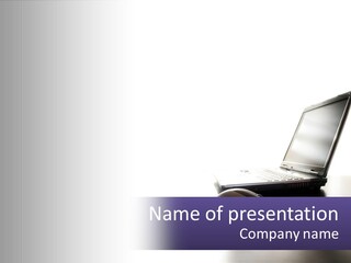 A Laptop Computer Sitting On Top Of A Desk PowerPoint Template
