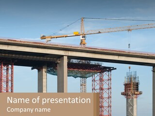 A Crane Is On Top Of A Building Under Construction PowerPoint Template