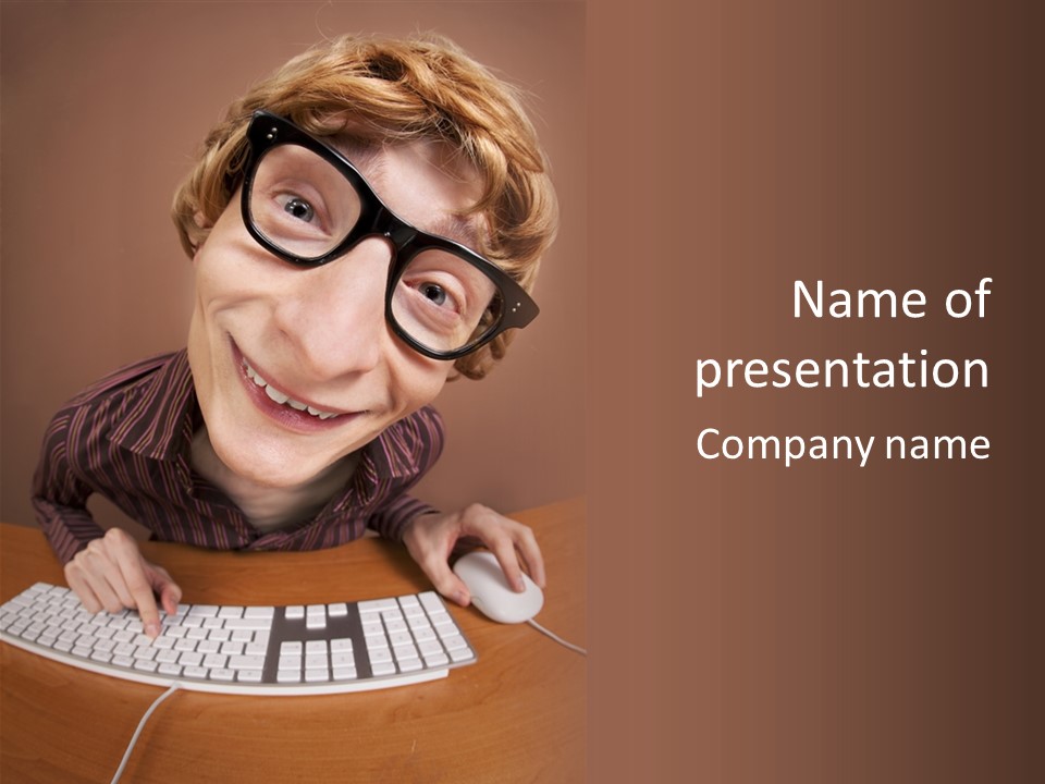A Young Man Wearing Glasses Is Typing On A Keyboard PowerPoint Template