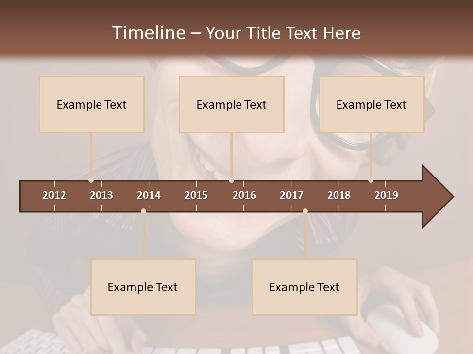 A Young Man Wearing Glasses Is Typing On A Keyboard PowerPoint Template