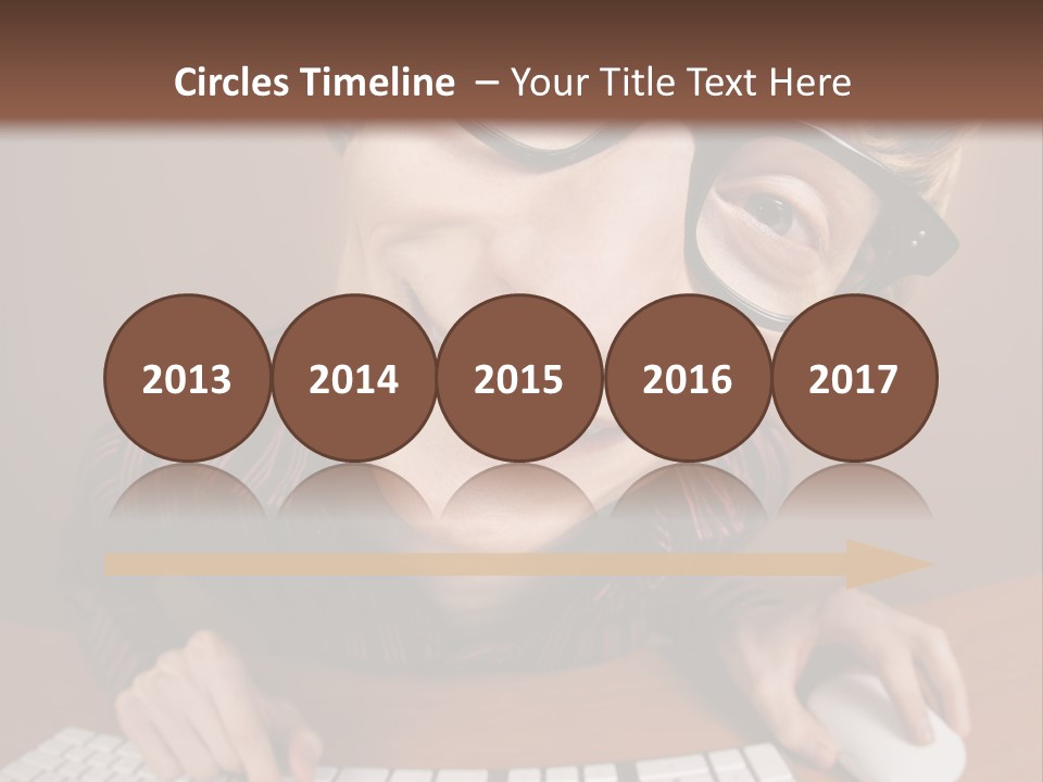 A Young Man Wearing Glasses Is Typing On A Keyboard PowerPoint Template