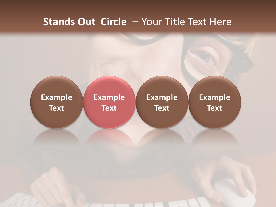 A Young Man Wearing Glasses Is Typing On A Keyboard PowerPoint Template