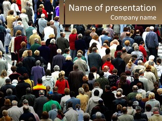 A Large Group Of People Walking Down A Street PowerPoint Template