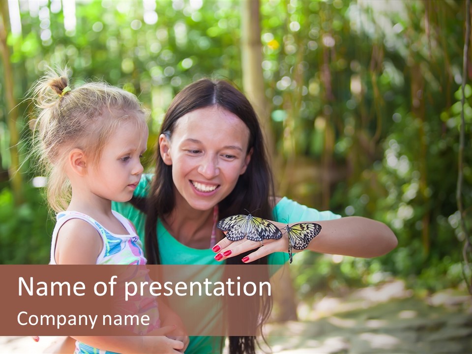 A Woman And A Little Girl Are Looking At A Butterfly PowerPoint Template